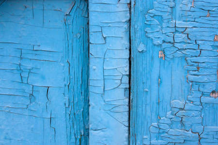part of an old blue fence on a farmの写真素材