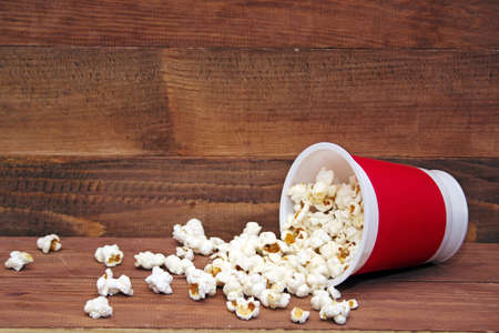 Popcorn bucket on a wooden backgroundの写真素材