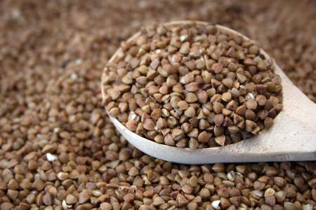 buckwheat in a wooden spoonの写真素材