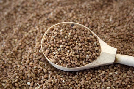 buckwheat in a wooden spoonの写真素材