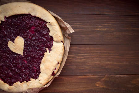 homemade cherry pie on a wooden backgroundの写真素材