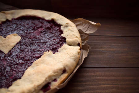 homemade cherry pie on a wooden backgroundの写真素材