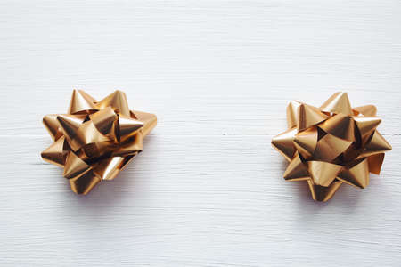 festive bows  on white wooden background, top viewの写真素材