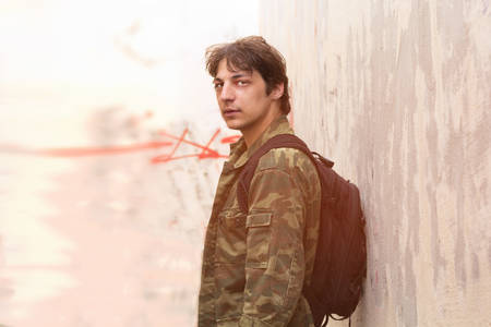 portrait of a young man with a backpack. copy space.の写真素材