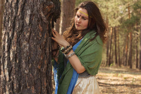 portrait of hippie girl in a forest. boho fashion  styleの写真素材