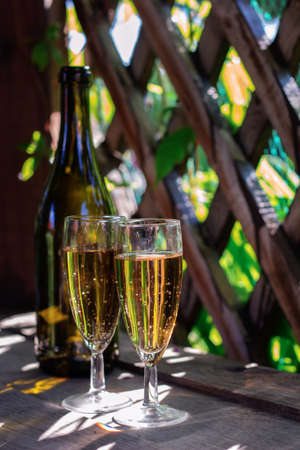 two glasses of white sparkling wine in the gazeboの写真素材