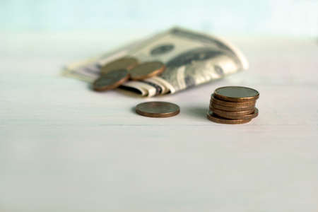 banknotes and coins on a white tableの写真素材