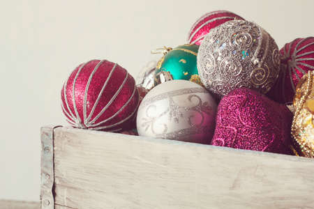 Christmas balls in vintage wooden box. toned.の写真素材