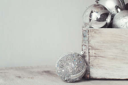 silver Christmas balls in a wooden vintage box. copy space.の写真素材