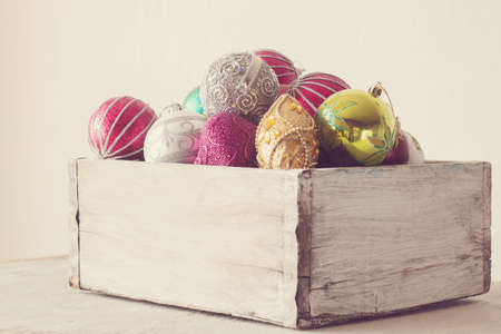 Christmas balls in a wooden vintage boxの写真素材