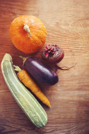 seasonal vegetables on wooden background, top viewの写真素材