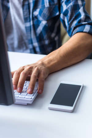 young man working in modern officeの写真素材
