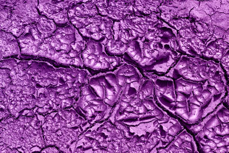 texture of a dry ground painted in purpleの写真素材