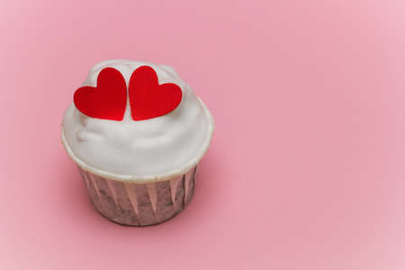 cute cupcake  on a pink pastel backgroundの写真素材