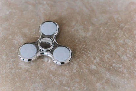 Silver toy spinner copyspaceの写真素材
