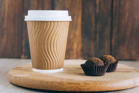 coffee to go and chocolate ballsの写真素材