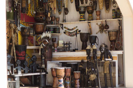 souvenir shop showcase with figurines and musical instrumentsの写真素材