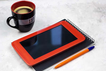 tablet,notebook,pen and coffee cup