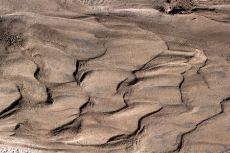 abstract background texture of wet sand and clayの写真素材