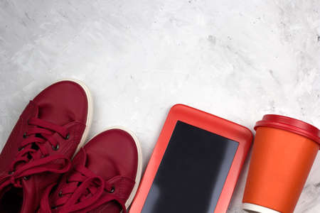 top view red sneakers,tablet, coffee to go cup ,copy spaceの写真素材
