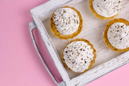 top view cupcakes with whipped cream pink pastel background