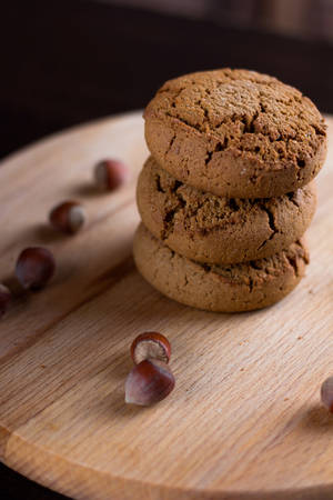 oatmeal cookies with hazelnuts wooden backgroundの写真素材