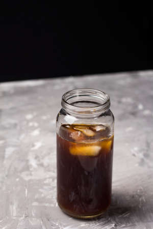 iced coffee drink in a glass botle concrete background copy spaceの写真素材