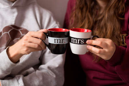 couple in love hands with cupsの写真素材