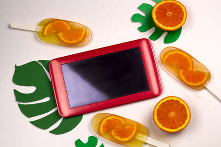 top view flat lay tablet and ice cream summer foods and travel appsの写真素材