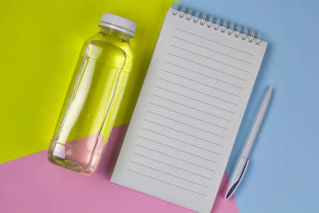 top view empty white sheet, water, pen bright backgroundの写真素材