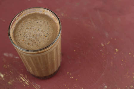 top view hot sweet homemade cocoa on a brown shabby wooden table