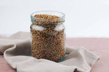 jar with uncooked buckwheat