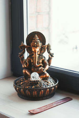 Ganesha statuette on a windowsill in yoga studio