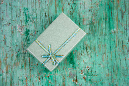 top view present box on a shabby wooden background