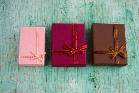 gift boxes  top view on shabby wooden background
