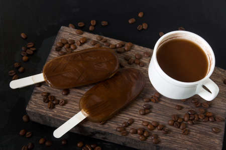 homemade coffee chocolate ice cream on a dark background, summer cold dessert