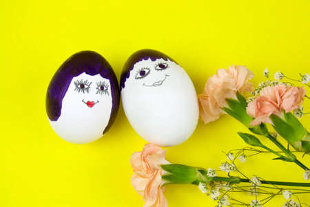 easter egg painted in man and woman funny cute faces
