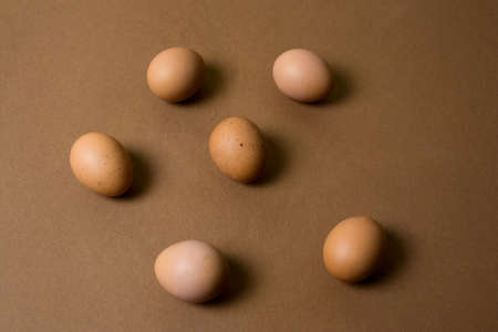 brown eggs pattern on a brown backgroundの写真素材