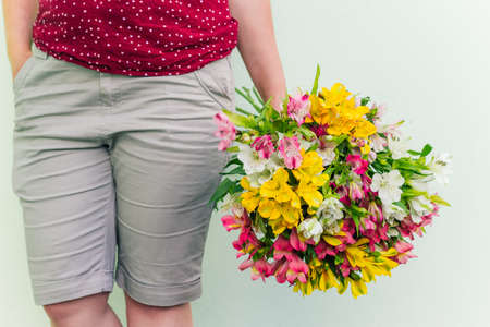 woman  holding Alstroemeria flowers bouquet