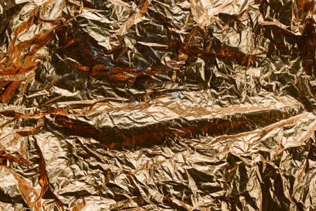 abstract textured golden foil backgroundの写真素材