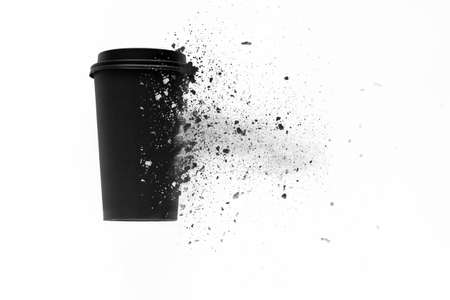 top view of the disposable coffee cup is decomposed into small pieces, ecological conceptの写真素材