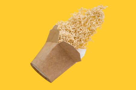 instant noodles flying on yellow background, asian fast food