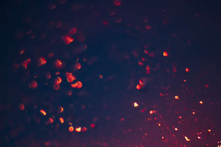 golden bokeh on a black background, garland lights blurred festive  abstract backdrop