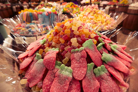 barrels with different types of marmalade in the candy store