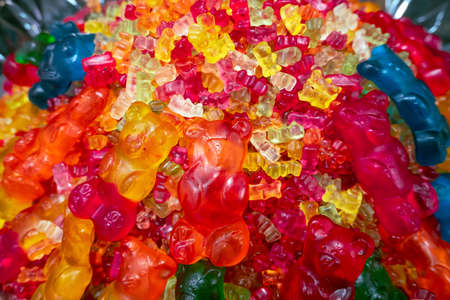 close up of assorted marmalade bears on the counter in a candy store