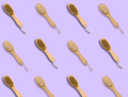 top view pattern brush for dry skin massage on a pastel violet background,copy spaceの写真素材