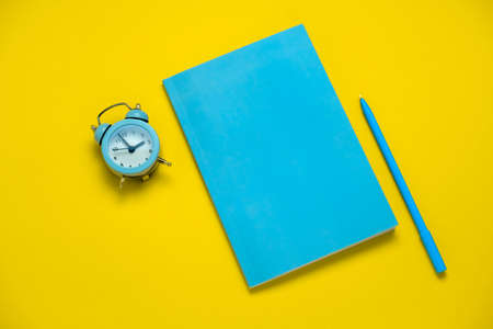top view work place flat lay with alarm clockの写真素材