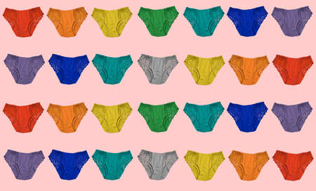 multicolored rainbow set of panties on a pink background, underwear pattern