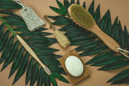 flat lay eco friendly spa kit, massage brush, bamboo toothbrush, pumice, wooden comb, natural soap, loofah spongeの写真素材