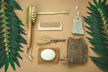 top view flat lay jute washcloth, loofah face sponge, bamboo tooth brush, natural pumice for foot...